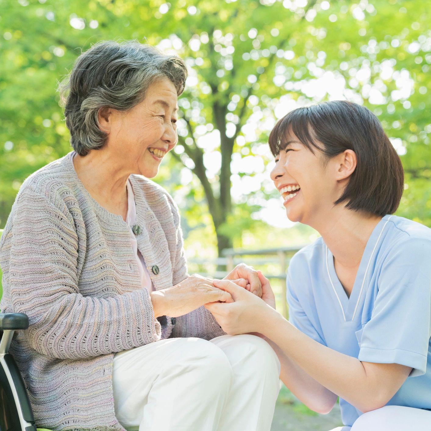 NDIS caregiver providing support to elderly Chinese-Australian woman in  Sydney garden.