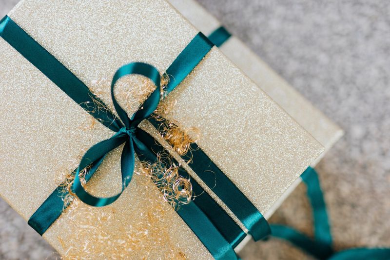 Wrapped golden gift boxes on the floor