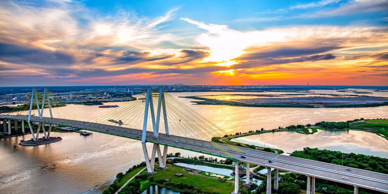 Fred Hartman suspension bridge at sunset.