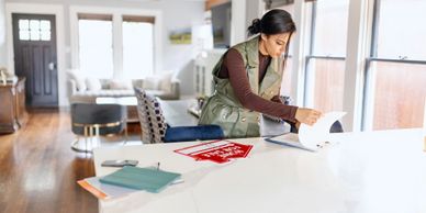 Workers washing and sorting fresh vegetables in a farm shed.