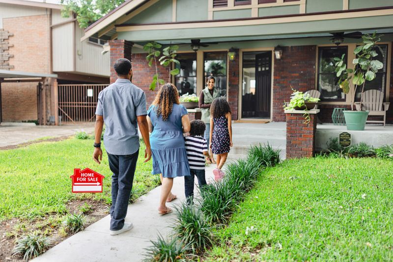 African American family meeting up with a real estate agent