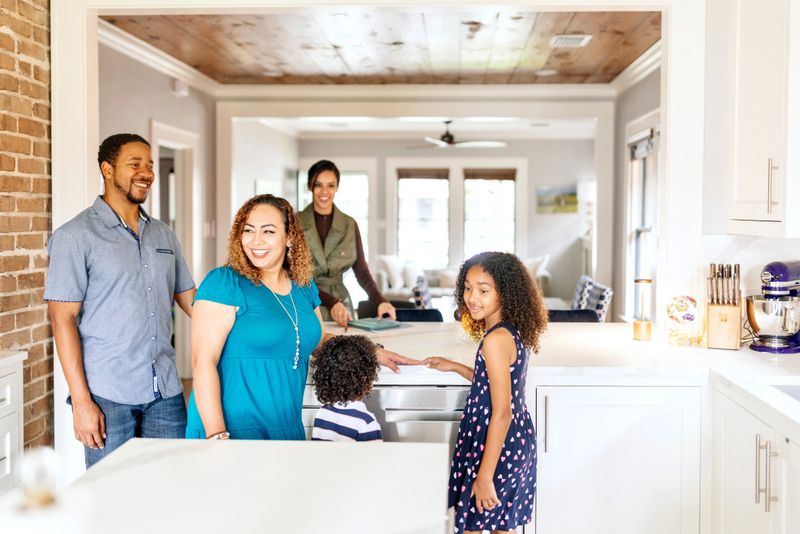 Smiling African American family in search for a new house