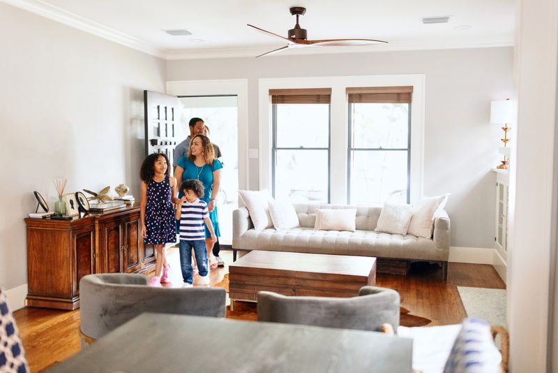 Real estate agent showing a house to her clients
