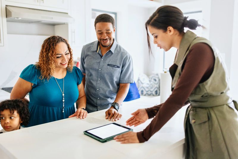 Woman working with her clients in real estate