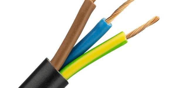 Close-up of electrical cables with brown, blue, and green-yellow wires.