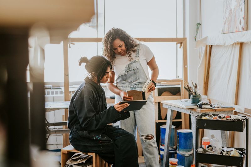 Woman artists collaborating together in their art studio