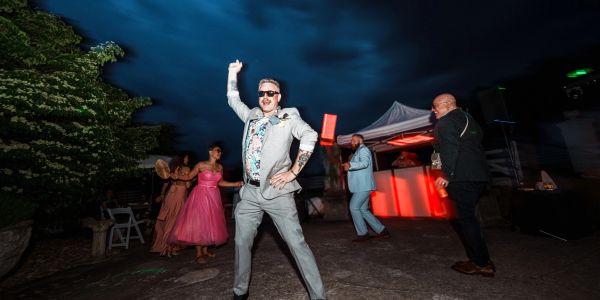 Man dancing confidently at nighttime party.