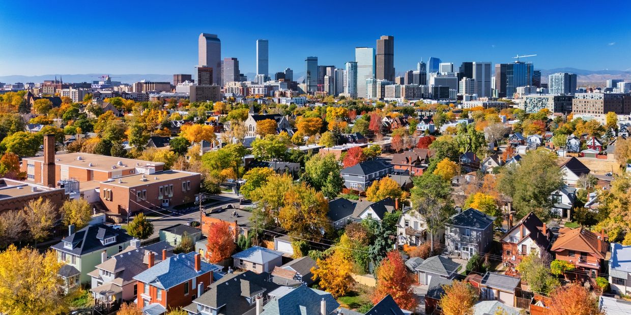 panoramic view of denver with the skyline in the back and neighborhood in foreground
