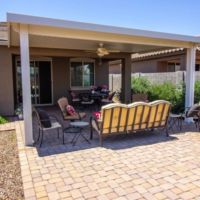 covered patio with pergola style closed ceiling shaded for comfort 