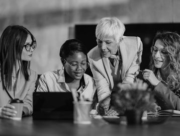 Several people learning with the help of a coach