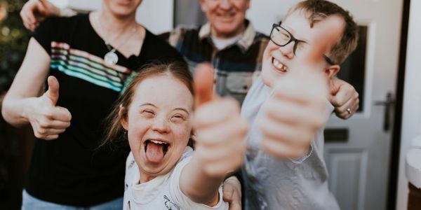 A picturesque landscape with mountains, a river, and a clear blue sky.