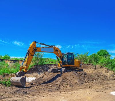 Excavator digging on a construction site. Heavy equipment for excavation services in Massachusetts.