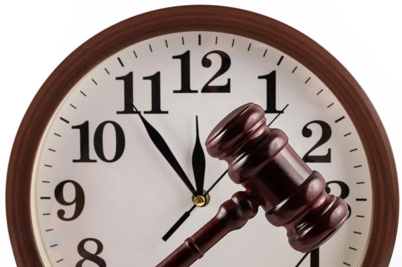 Ordinary wall clock and judge's gavel