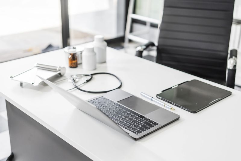 A clean desk with medical equipment, ready for professional use, sits empty, awaiting the next task or appointment.