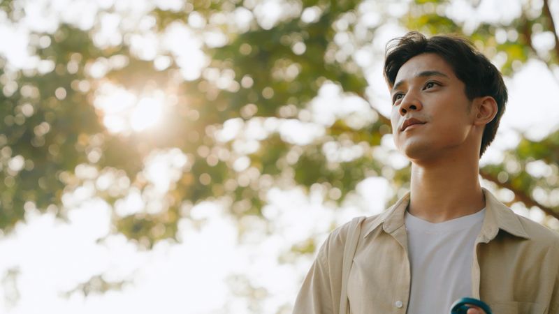 Young Man Embracing Mindfulness in Nature, Mental Health Awareness, Tranquility and Peacefulness