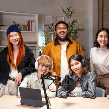 A diverse group of friends enjoying a podcast recording session together.