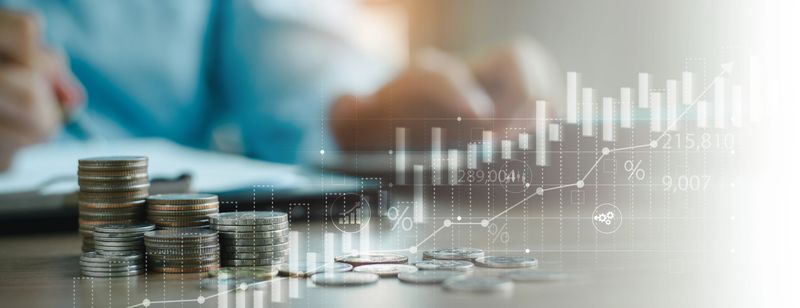 finance and investment, currency exchange concept. Accountant using calculator with coins and financial report, economic graph growth, finance background, Business, accounting banking concept.