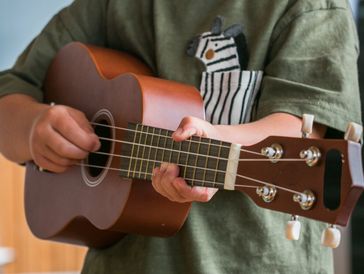 A ukulele player. 