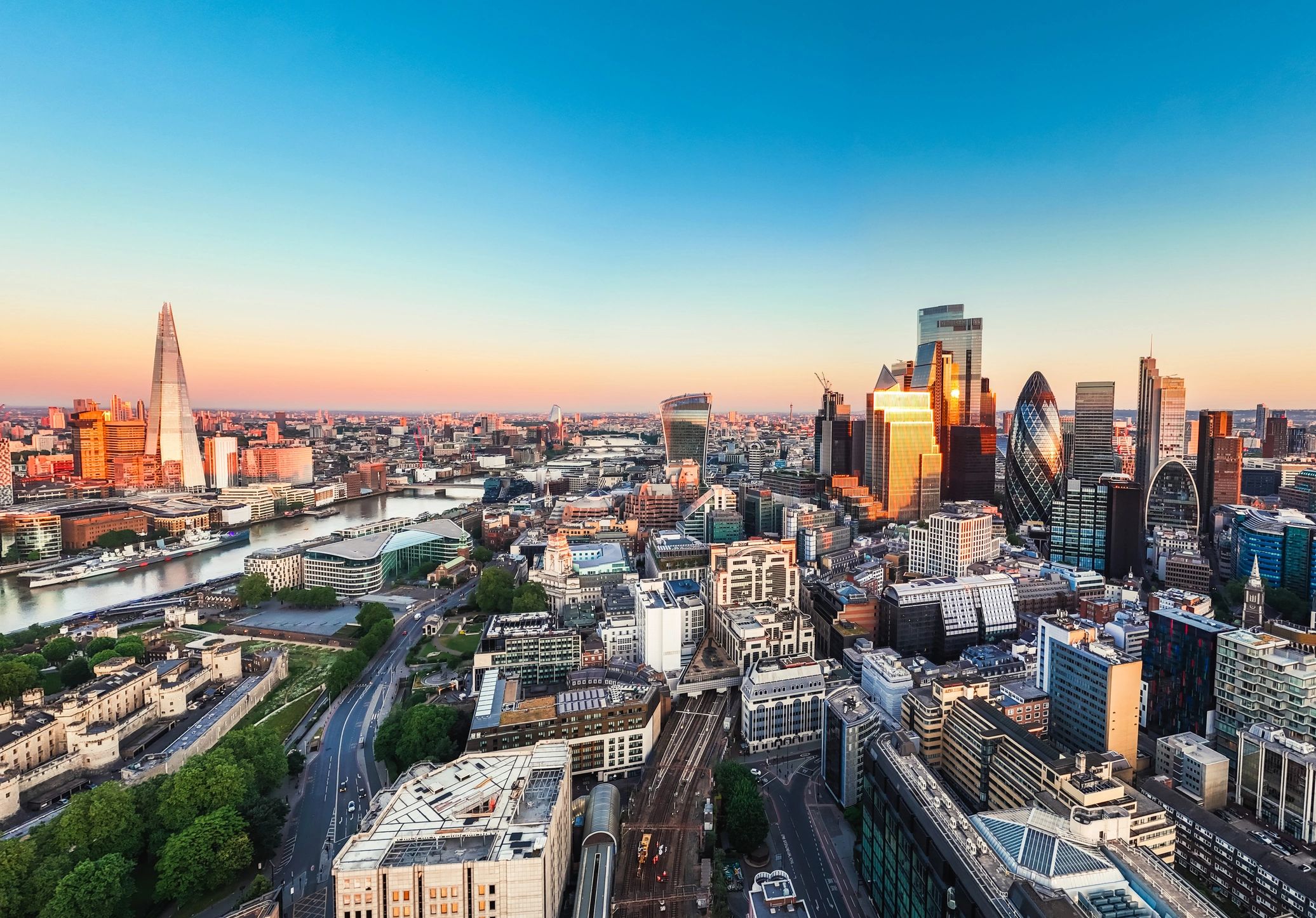 A panaromic landscape picture of London showing the Shard, The Gherkin and the CheeseGrater