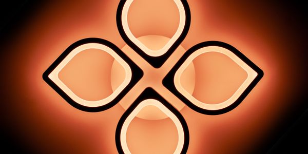 Modern ceiling light fixture with four petal-shaped glowing sections.
