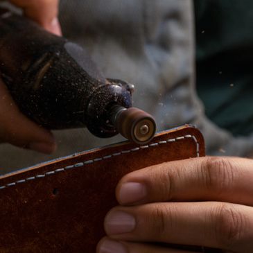 Grinding tool working on leather craft.