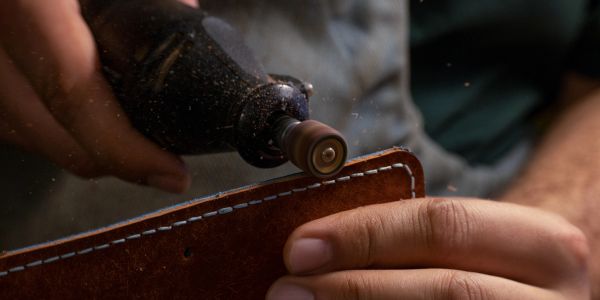 Close-up of leather crafting with rotary tool.