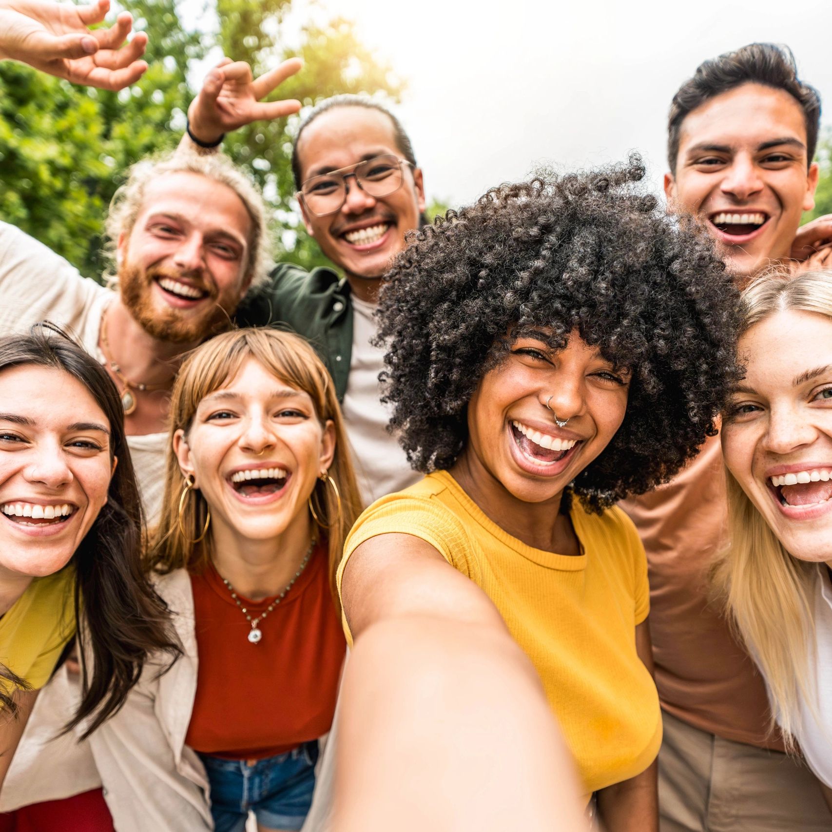 Group of smiling diverse young adults (community, energy)