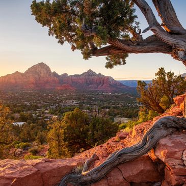 Sunset view over red rock mountains and valley.