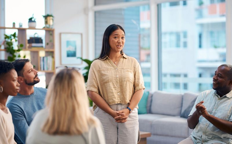Diverse Group of People Attending a Support Group Meeting in a Comfortable Setting