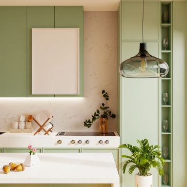 Modern kitchen with pastel green cabinets and minimalist design.