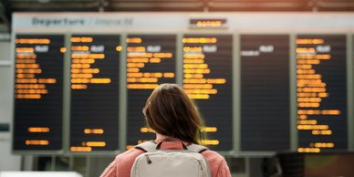 Person looking for air travel board changes