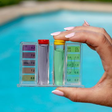 testing the pool water with manual test kit
