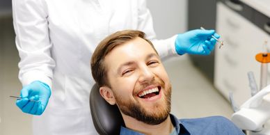 Happy man at the dentist.