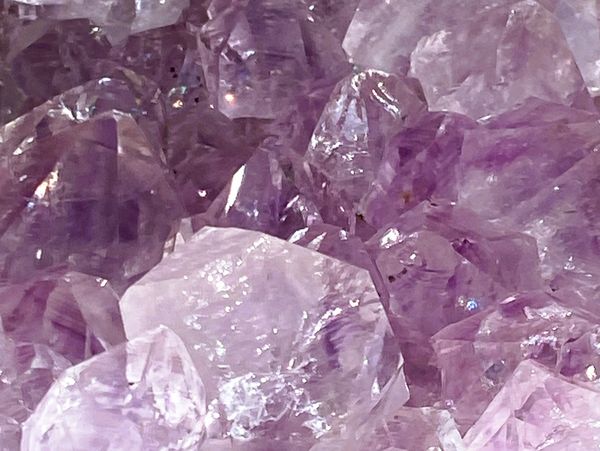 Close-up of sparkling purple amethyst crystals.