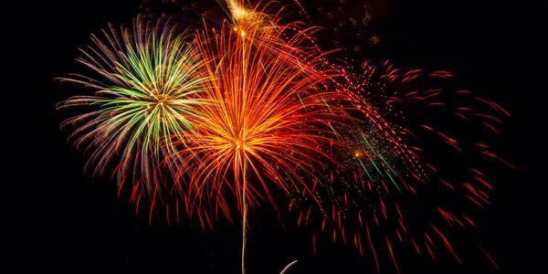 Colorful fireworks bursting against the night sky.