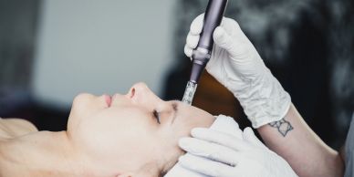 Close-up of a person receiving a cosmetic facial treatment.