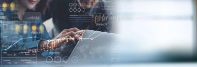 Person analyzing digital financial data on a laptop.