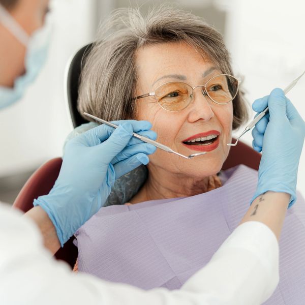 Smile makeover with full mouth rehab and teeth fixing at dental clinic in Bengaluru