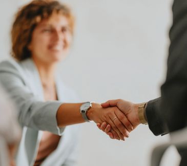 Bright red RAM pickup truck with aggressive tires and custom fender flares.