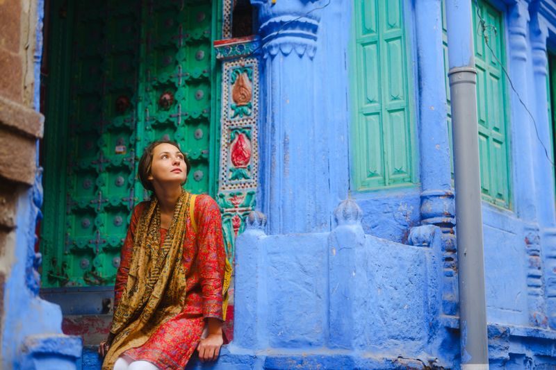 Serene woman exploring Jodhpur city during her trip to India