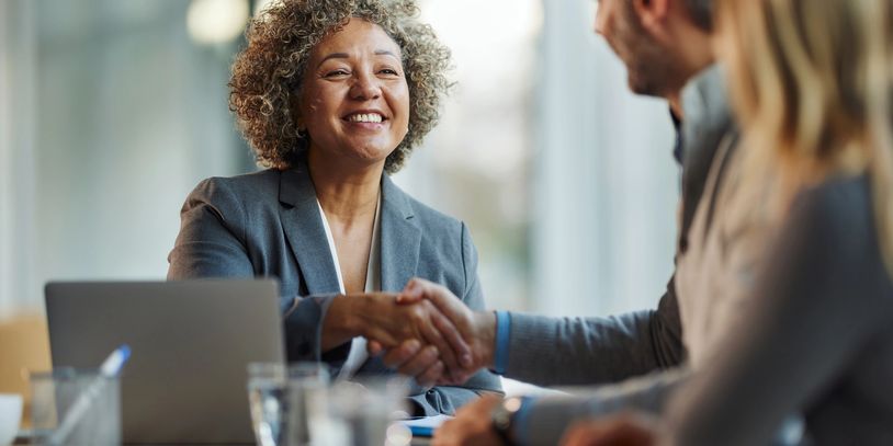 two people shaking their hands