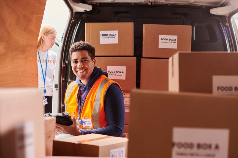 young volunteer delivering food parcels