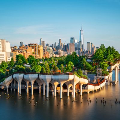 Floating park with city skyline in the background.