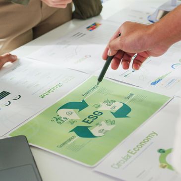 People discussing ESG (Environment, Social, Governance) reports in a meeting.