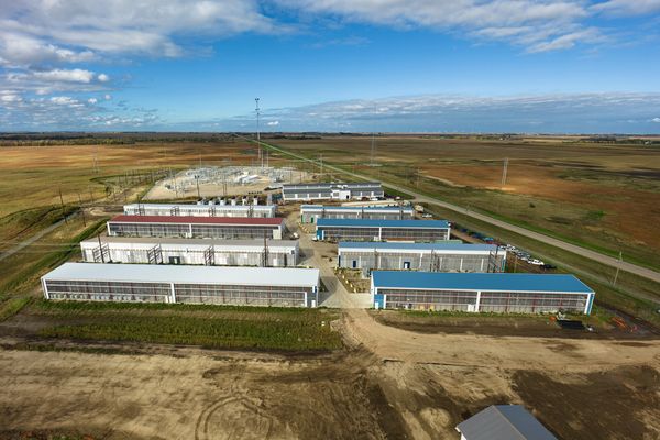 Aerial view of an industrial or farming complex with multiple buildings.