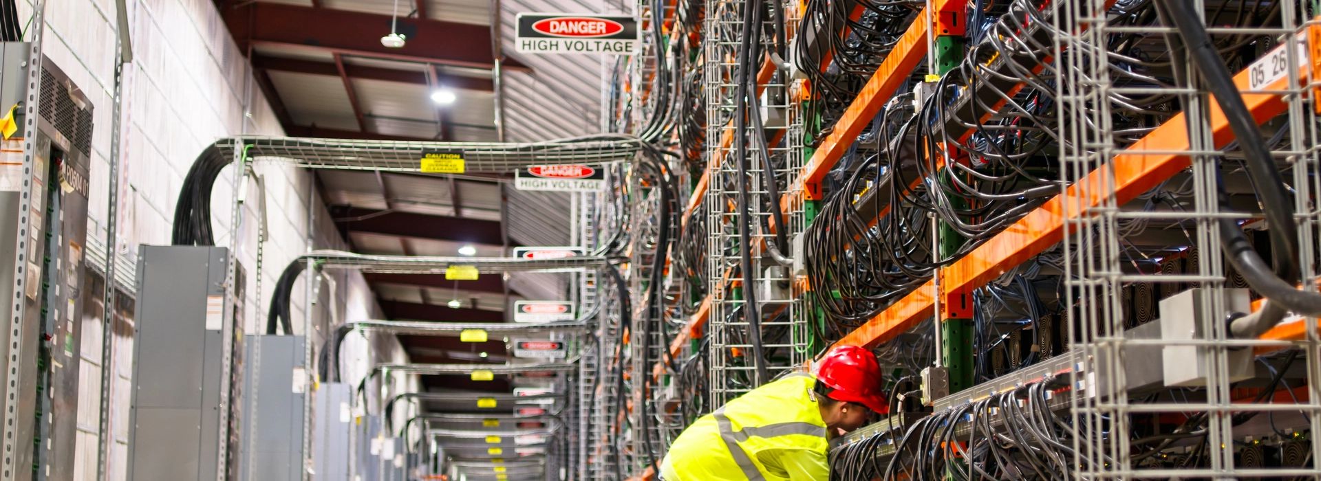 Electrician working on commercial warehouse electrical system