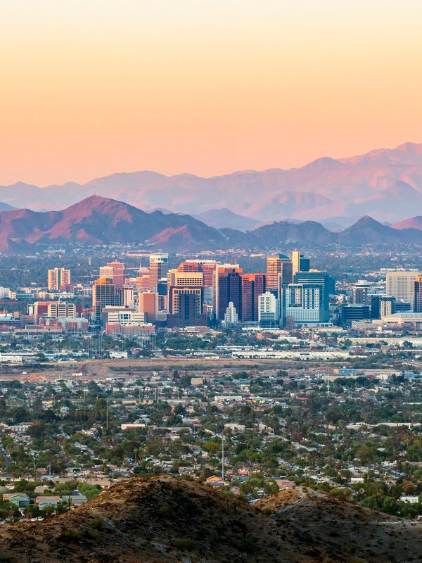 Panoramic sunset view over the Phoenix, Arizona skyline, representing statewide telehealth coverage