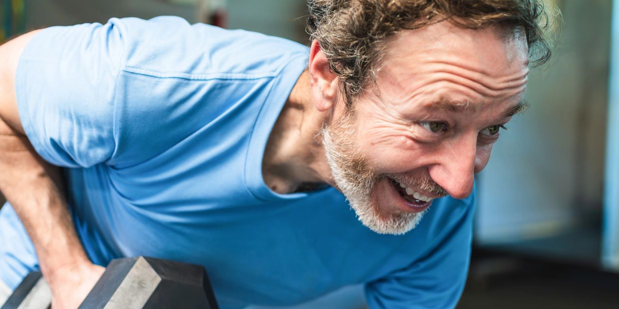 stock image middle age man working out. Not an actual patient of Alphagenics TRT & Weight Loss