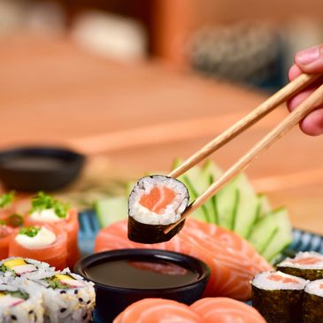 Image of many dishes of sushi