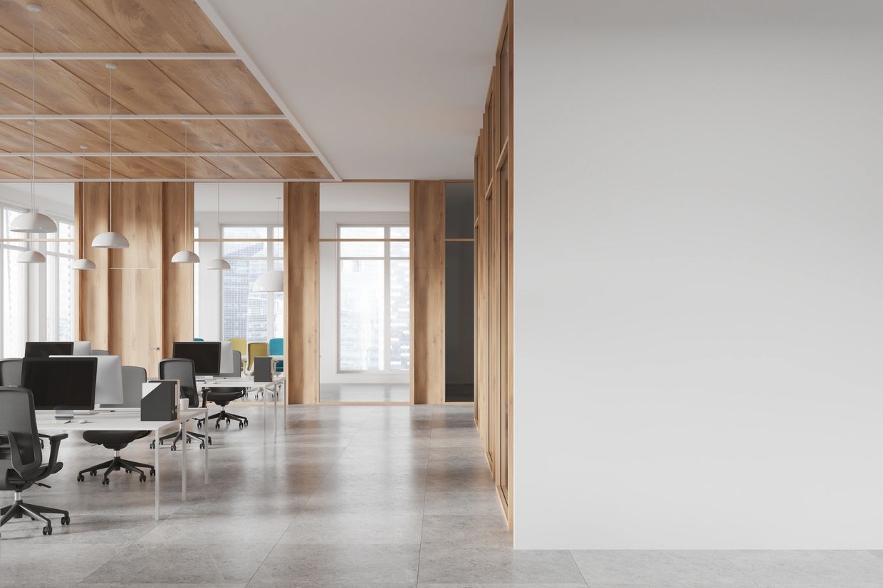 Modern office space with wooden accents and sleek workstations.